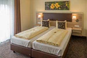 Postel nebo postele na pokoji v ubytování Hotel Sonnengarten