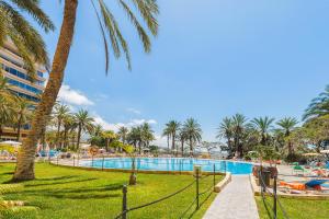 a resort with a swimming pool and palm trees at MARAZUL VISTA AL MAR in Callao Salvaje