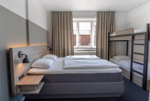 Letto o letti in una camera di Copenhagen Go Hotel