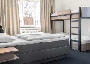 Letto o letti in una camera di Copenhagen Go Hotel