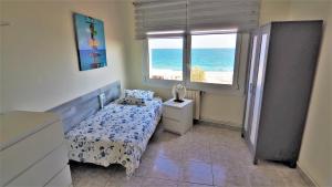 Posteľ alebo postele v izbe v ubytovaní MARILU SEAVIEW & BEACH - apartment