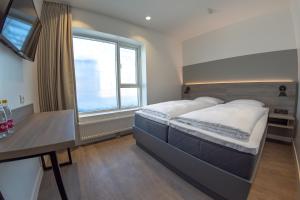 Letto o letti in una camera di Copenhagen Go Hotel