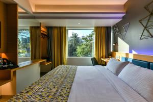 Postel nebo postele na pokoji v ubytování Indie Stays, BKC