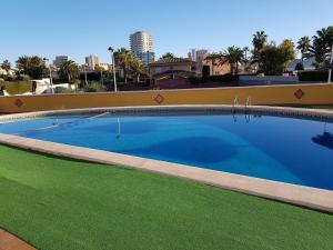 The swimming pool at or close to Apartamentos Olympia Center