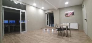 a dining room with a table and chairs at Budziechów Noclegi in Lubsko +4 photos