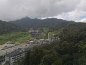a view of a city with mountains in the background at 3 Rooms Apt @ Crown Imperial Court in Cameron Highlands