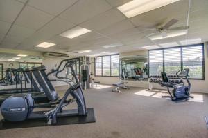 a gym with treadmills and cardio equipment in a building at 2 Bed 2 Bath Apartment in Shores at Waikoloa in Waikoloa