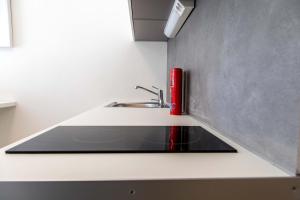 A kitchen or kitchenette at The Modern Suite