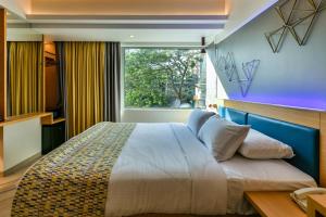 Postel nebo postele na pokoji v ubytování Indie Stays, BKC