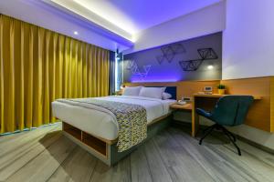 Postel nebo postele na pokoji v ubytování Indie Stays, BKC