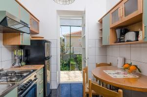 A kitchen or kitchenette at Holiday home Marko - 70m from sea