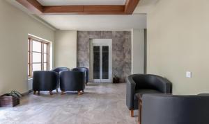 a row of chairs in a waiting room at Treebo Trend Casino in Kozhikode