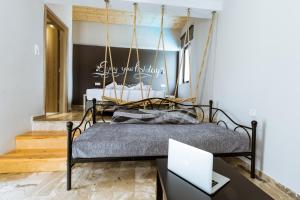 Postel nebo postele na pokoji v ubytování Gregory Comfort Hotel