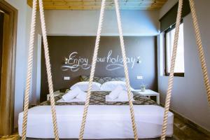 Postel nebo postele na pokoji v ubytování Gregory Comfort Hotel