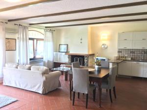 a living room with a table and a couch at Il Montetto Mare e Natura in Arcola +35 photos
