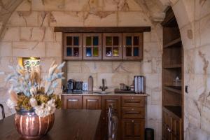 a kitchen with a wooden counter top in a room at Kayakapi Premium Caves Cappadocia in Ürgüp