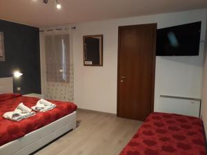 Postel nebo postele na pokoji v ubytování B&B Casa Taty