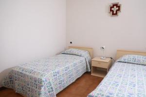 מיטה או מיטות בחדר ב-La Casa di Francesco e Lucia