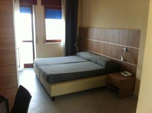 Postel nebo postele na pokoji v ubytování Elihotel