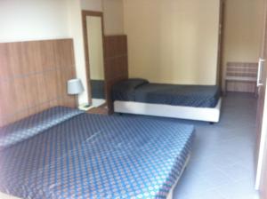 Postel nebo postele na pokoji v ubytování Elihotel