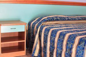 Säng eller sängar i ett rum på Hotel Bahamas