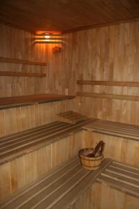 a sauna with a basket in the middle of it at Bumerang Hotel in Lviv