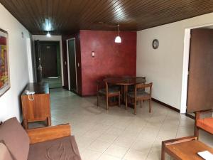 a dining room with a table and chairs at Apartamentos Percales in Bogotá +4 photos