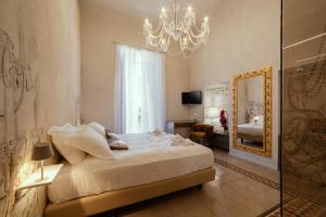 Katil atau katil-katil dalam bilik di Palazzo dei Grifoni - Luxury Suites -