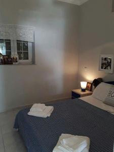 Postel nebo postele na pokoji v ubytování Kalymnos Beach House