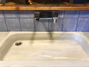 a sink with a faucet in a bathroom at Casa Mingot SXVI Anciles Benasque in Anciles