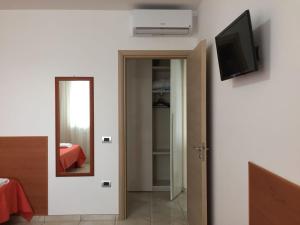 TV a/nebo společenská místnost v ubytování Appartamento Nadia