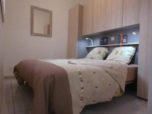 En eller flere senge i et værelse på Rue de Corfou Les Grenadines