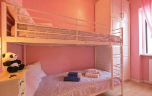 a bedroom with two bunk beds with a teddy bear at GAETA - Villa Fontania in Gaeta +34 photos