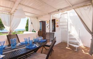 a table with blue dishes on it on a patio at GAETA - Villa Fontania in Gaeta
