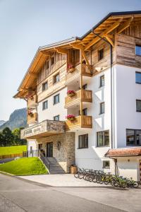 a building with bikes parked in front of it at OFENTÜRL alpine living in Flachau