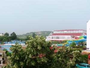 a resort with a pool and a water park at Arkadia Guest House in Primorsko