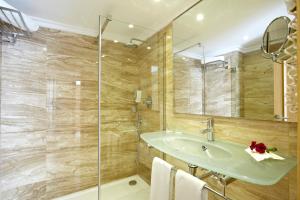 a bathroom with a sink and a shower at Grupotel Los Príncipes & Spa in Playa de Muro