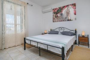 Postel nebo postele na pokoji v ubytování Zanart Maisonette