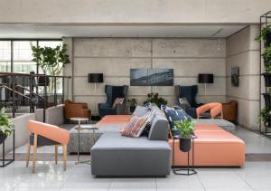 TV a/nebo společenská místnost v ubytování Hotel Murano