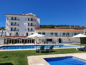 a view of the hotel and the swimming pool at Marina Tossa in Tossa de Mar