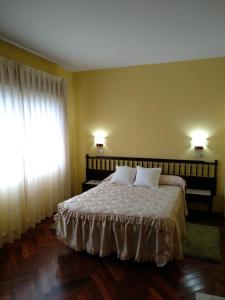 Postel nebo postele na pokoji v ubytování HOTEL CORINTO