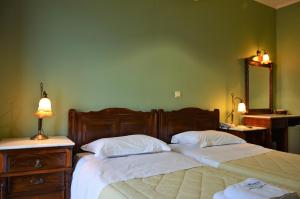 Postelja oz. postelje v sobi nastanitve Ilion Hotel