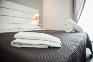 Posteľ alebo postele v izbe v ubytovaní L'ANTICO FONDACO