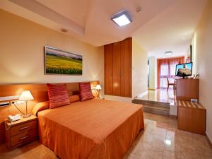Posteľ alebo postele v izbe v ubytovaní Hotel Anna