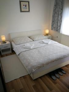 Postel nebo postele na pokoji v ubytování Apartman Marija Brajdic