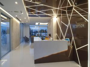 a person sitting at a reception desk in an office at Perla Luxury in Ulcinj