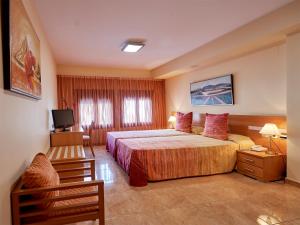 Posteľ alebo postele v izbe v ubytovaní Hotel Anna