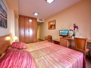 Posteľ alebo postele v izbe v ubytovaní Hotel Anna