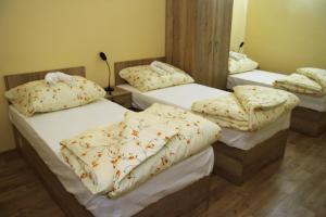 מיטה או מיטות בחדר ב-Penzion Daníž
