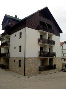 a building with balconies on the side of it at Apartment Marjana in Zlatibor